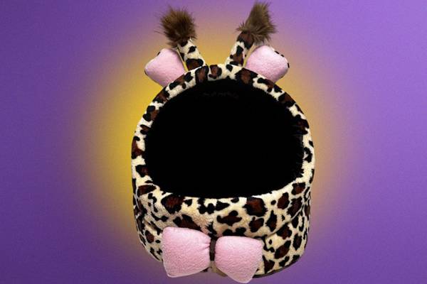 Cute leopard print pet bed with pink bows and ears.